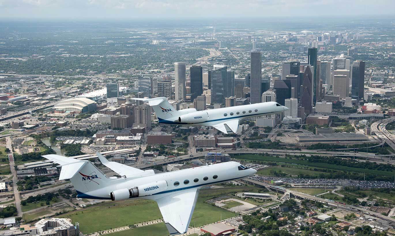 Two NASA planes fly over downtown Houston, Texas