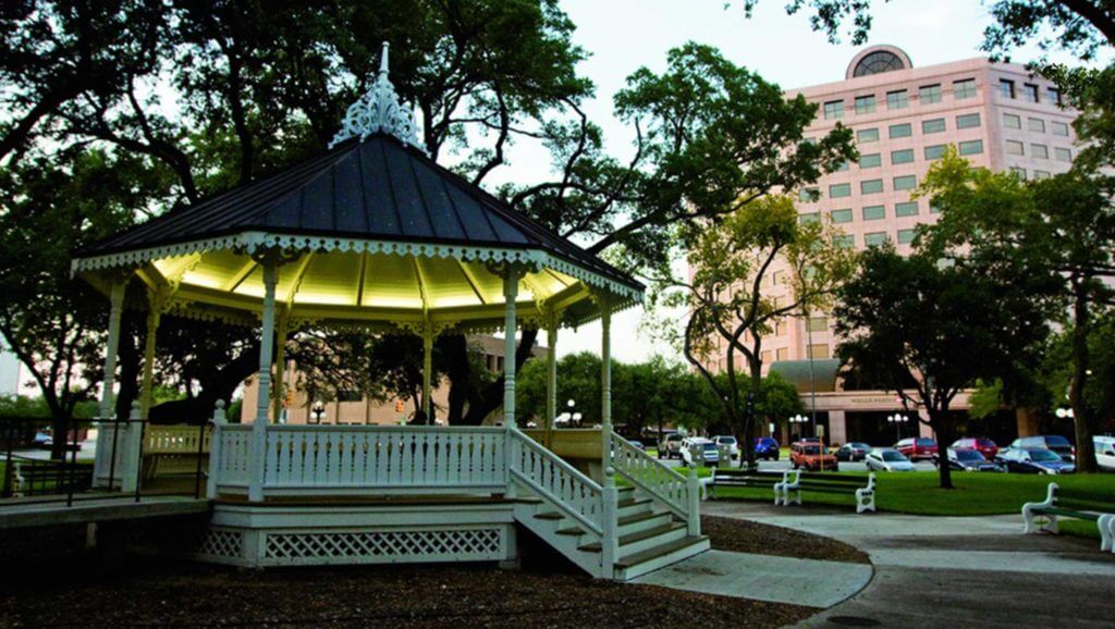 A gazebo is lit up at dusk in front of the One O'Connor Plaza in Victoria, Texas