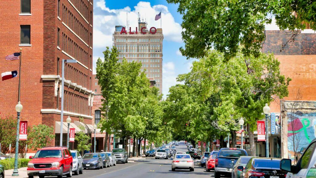 View of Austin Avenue in Waco, Texas, with the Alico building standing tall in the background