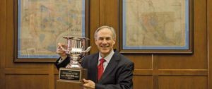 Governor Abbott holding the 2017 Texas Governor's Cup