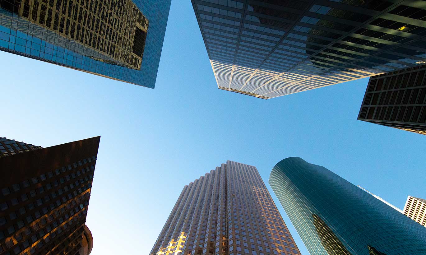 A shot looking up at skyrise buildings in Houston, Texas.