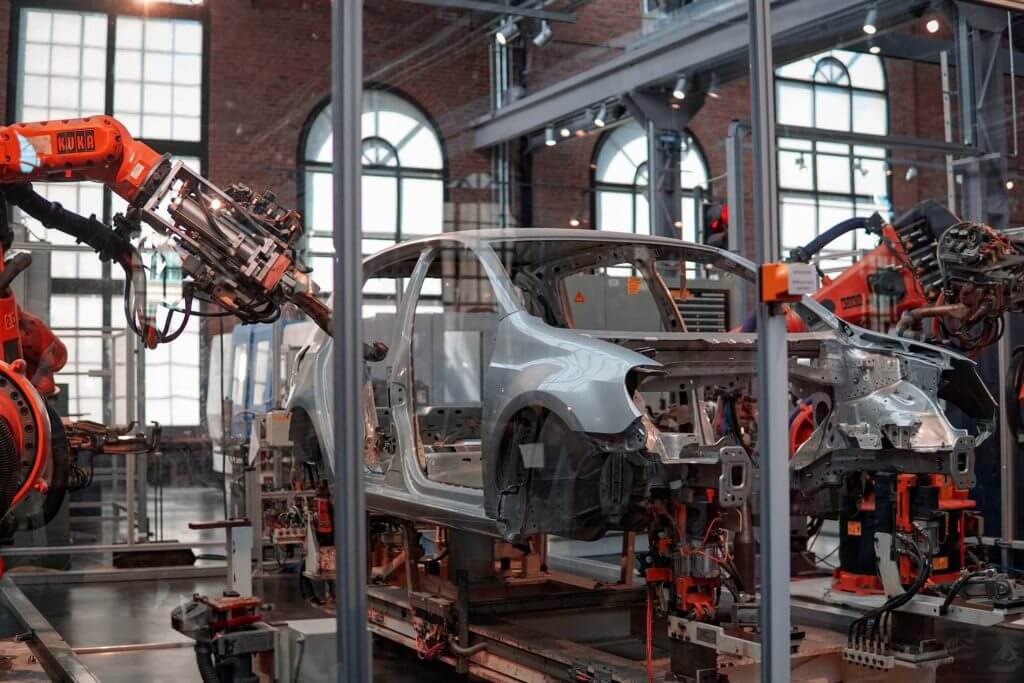 A car being assembled by robots