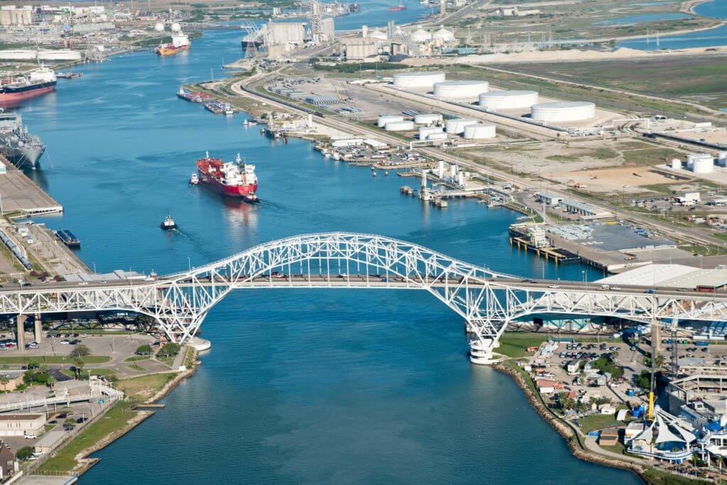 White bridge at the Port of Corpus Christi stretches over the Blue River