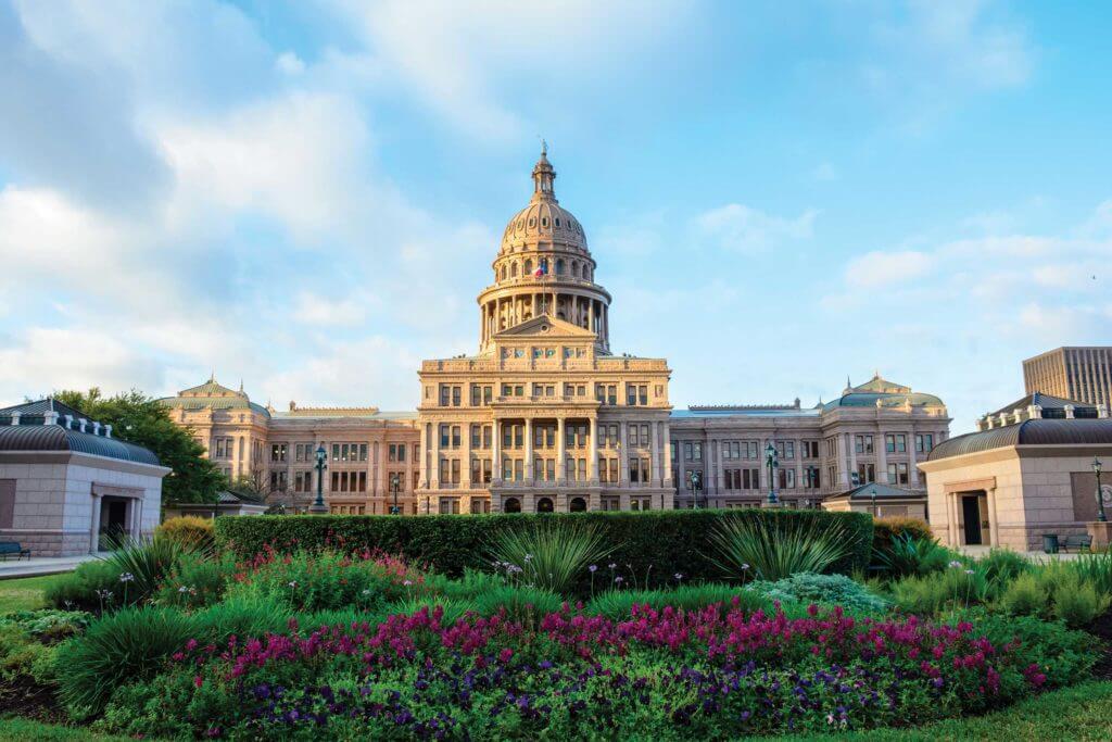 Gardens and flowers bloom in the spring in front of the Texas State Capitol building in Austin