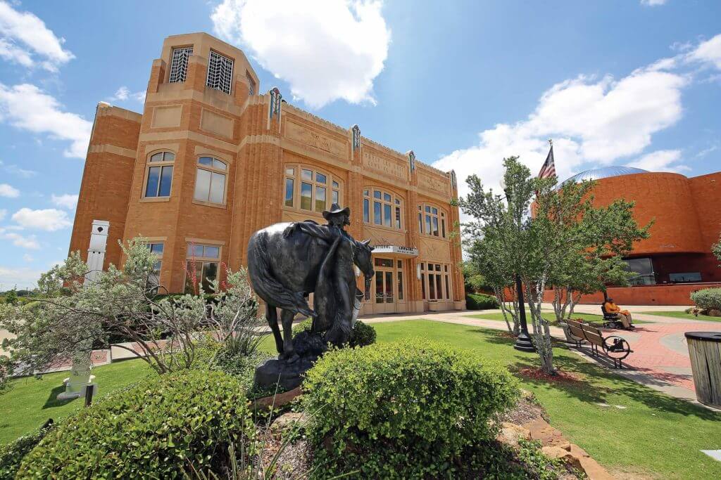 A statue of a cowgirl outside the entrance to the Cowgirl Hall of Fame & Museum in Fort Worth, Texas