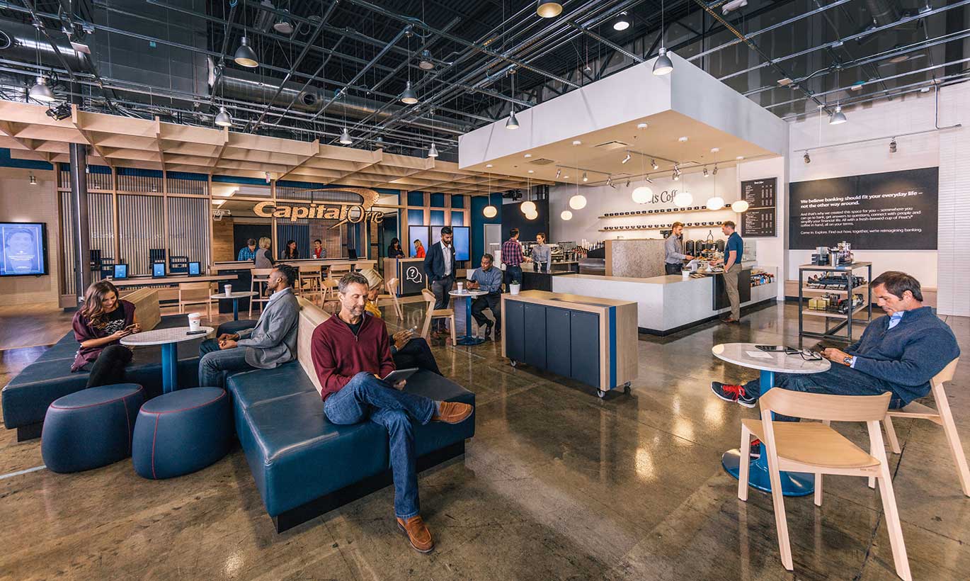 Businesspeople network and eat lunch in the Capital One cafe