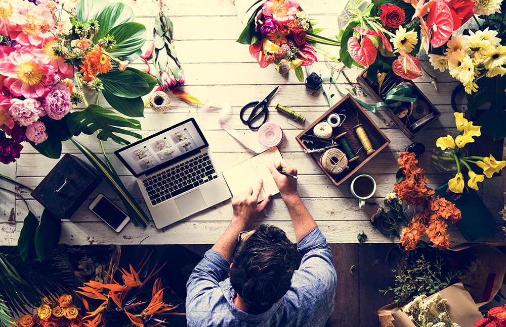 Overview of man working at a flower shop