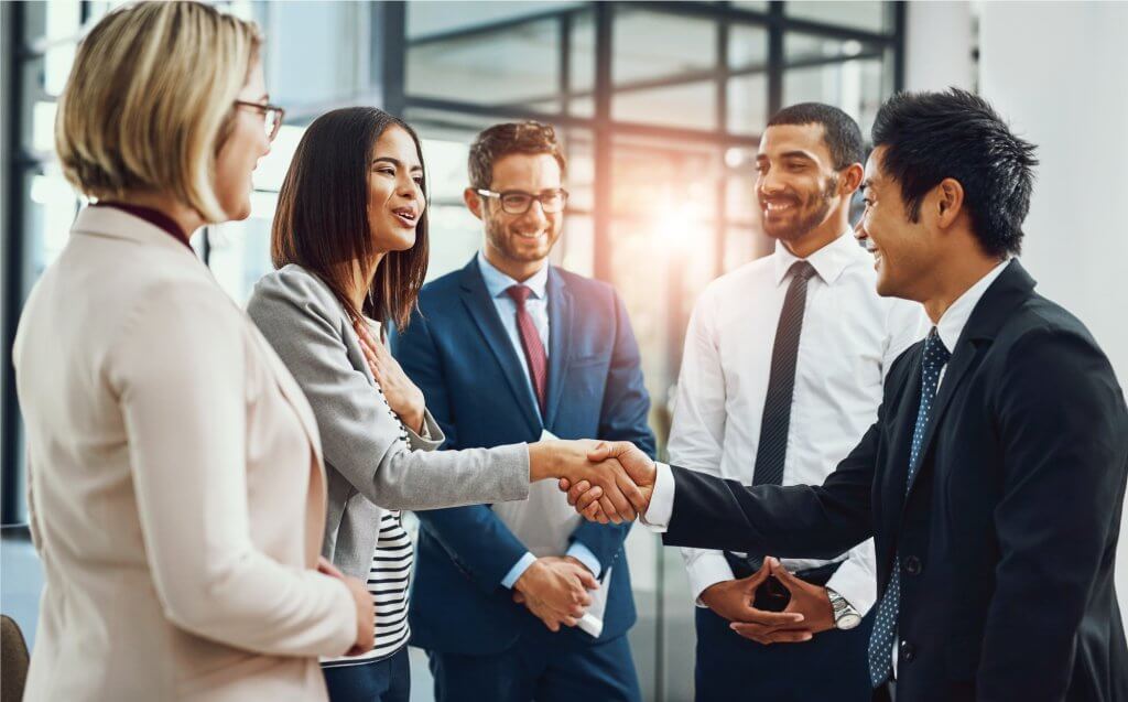 A group of business people shaking hands