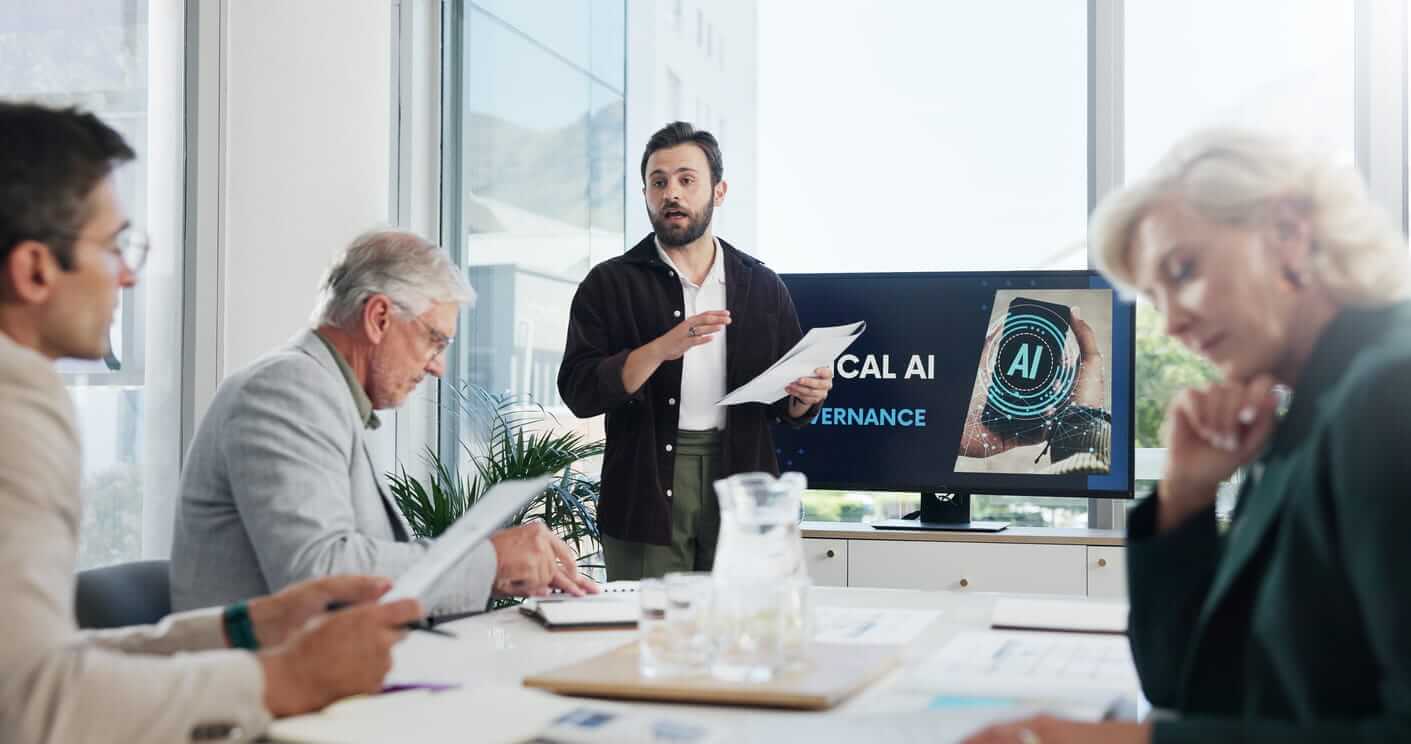 Presentation, paperwork and businessman in office with team for AI governance system. Discussion, professional and IT developer with investors for investment planning with corporate cybersecurity