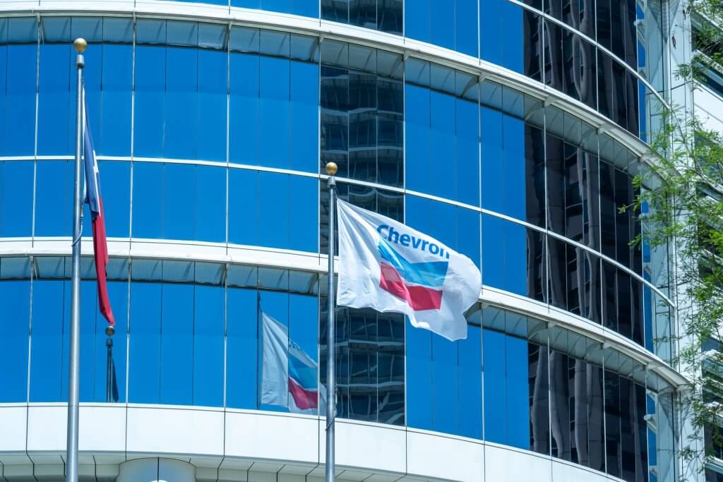 The flags at Chevron Corporation office building in Houston, Texas, USA. Chevron Corporation is an American multinational energy corporation